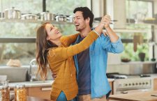 Shot of an affectionate young couple dancing in their kitchen